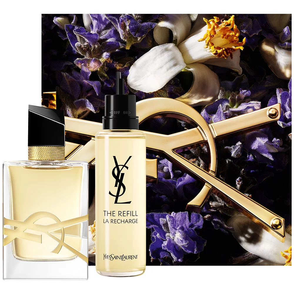 A stylish display featuring a perfume bottle and a refill bottle against a background of vibrant flowers and elegant YSL branding.