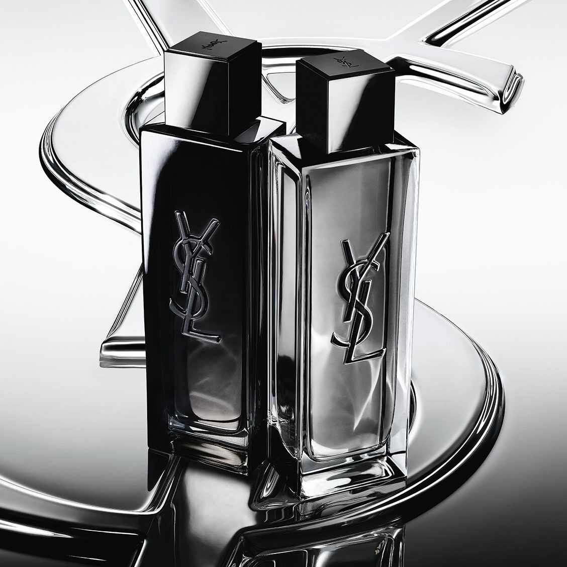 Deux flacons de parfum YSL noirs et argentes
