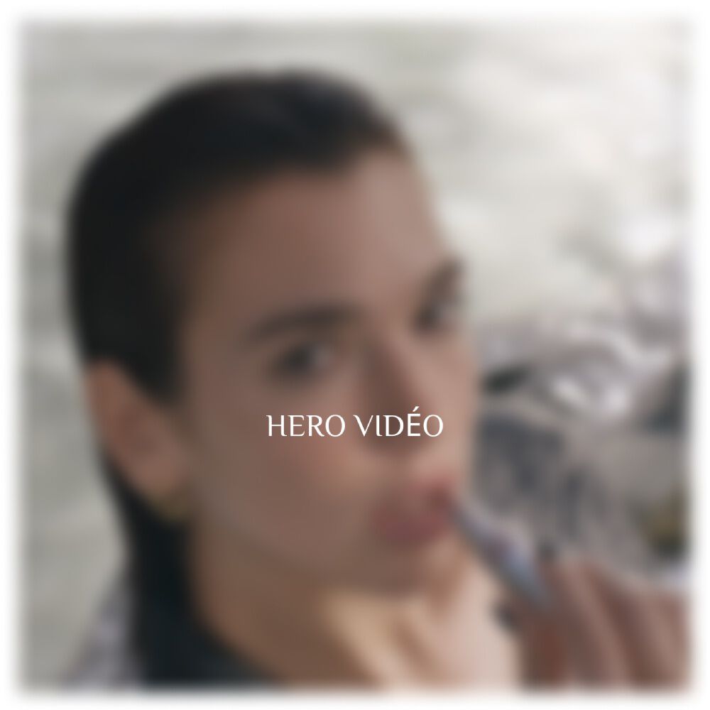 A blurred image of a person with short hair, appearing to be in water, with the text "HERO VIDEO" prominently displayed.
