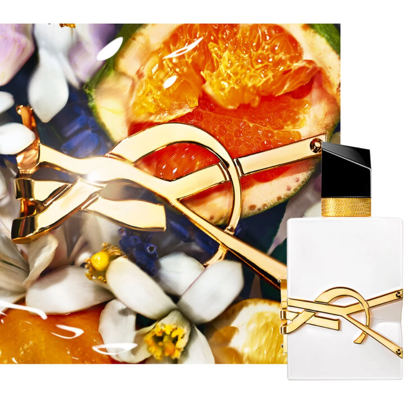 A close-up of a luxurious perfume bottle accompanied by vibrant, colorful fruits and flowers in a decorative arrangement, highlighting the fragrance's elegance.