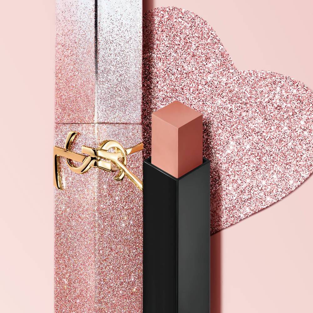YSL Rouge Pur Couture The Slim Lipstick in a limited edition glitter case, with the bullet exposed, on a pink background.