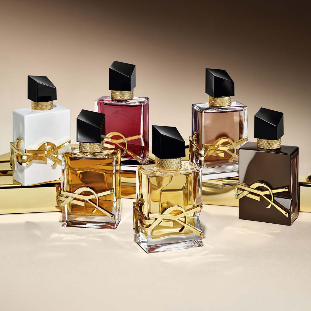 Collection of Libre fragrance bottles including the new glazed brown Libre Santal Couture.