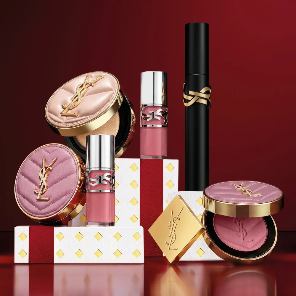 Selection of YSL makeup icons including Lash Clash mascara on festive boxes.