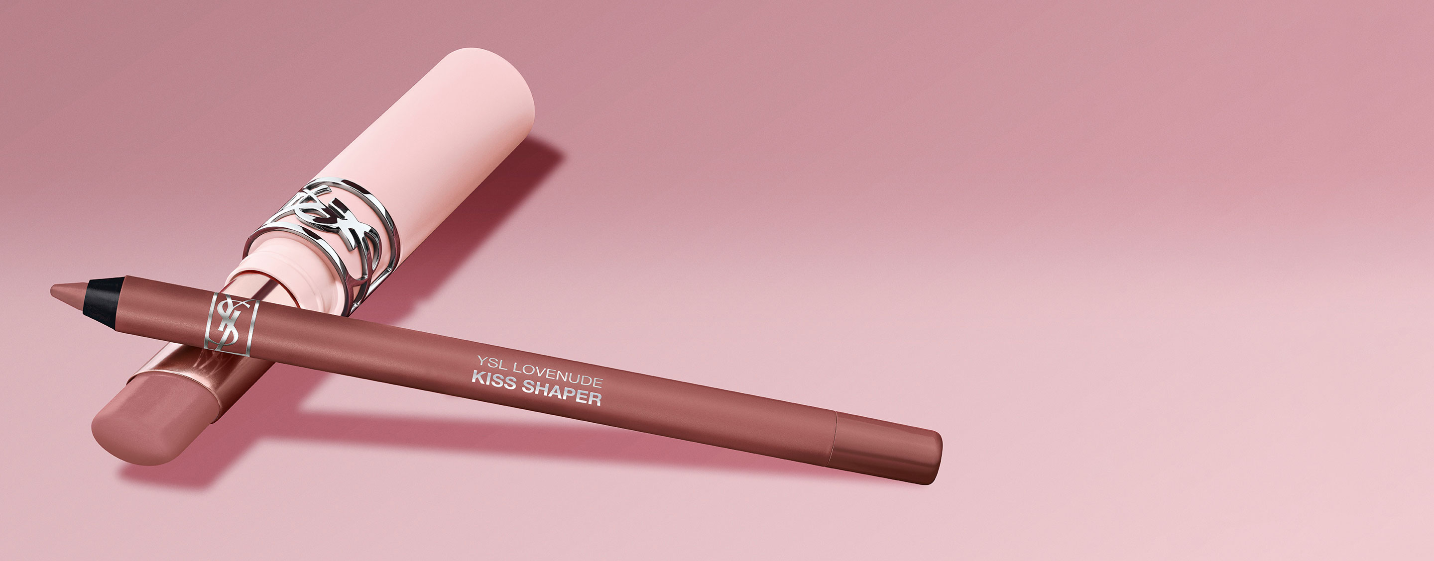 YSL Kiss Shaper lippotlood en bijbehorend lipproduct op een roze achtergrond.